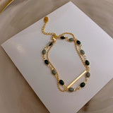 Pulsera doble con charms