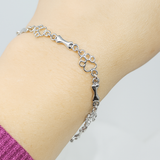 Pulsera con Colgantes de Pata de Perro y Hueso en Plata Pura