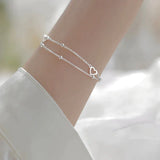 Pulsera ajustable con corazón en plata