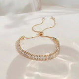 Pulsera ajustable de circonita cúbica en oro y plata