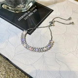 Pulsera ajustable de circonita cúbica en oro y plata