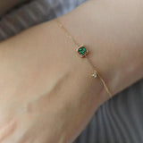 Pulsera de oro con cristal verde