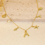 Collar con letra en bambú, estrella de mar y concha