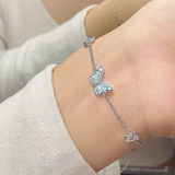 Conjunto de collar y pulsera con mariposa luminosa azul