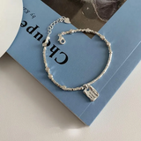Pulsera cuadrada Amor Plateada