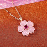 Collar con colgante de flor rosa dorada